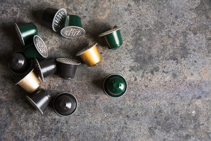 coffee capsules on grunge background