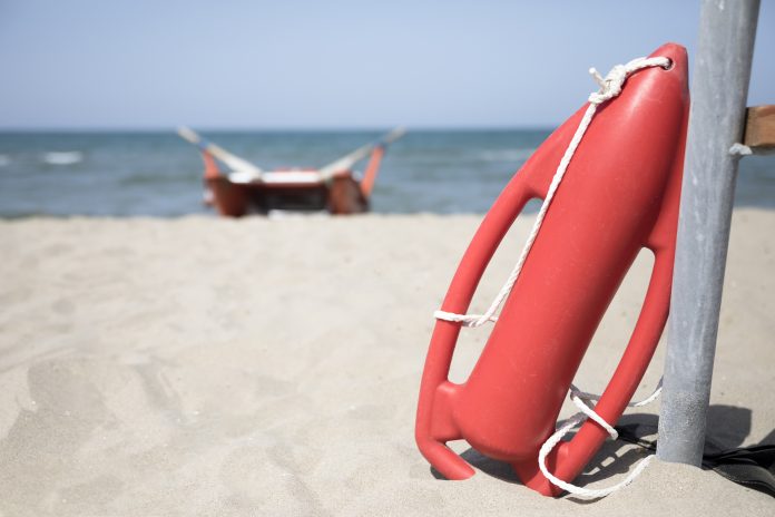close-up-red-rescue-can-on-beach